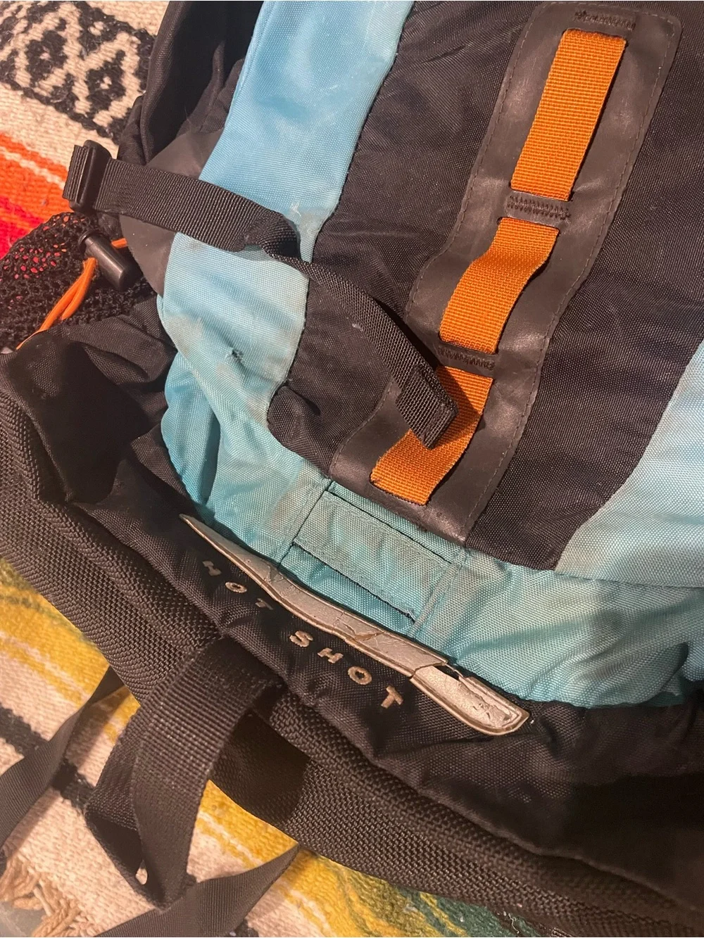 The North Face Men’s “Hot Shot” Blue and Black Backpack with Orange Accents